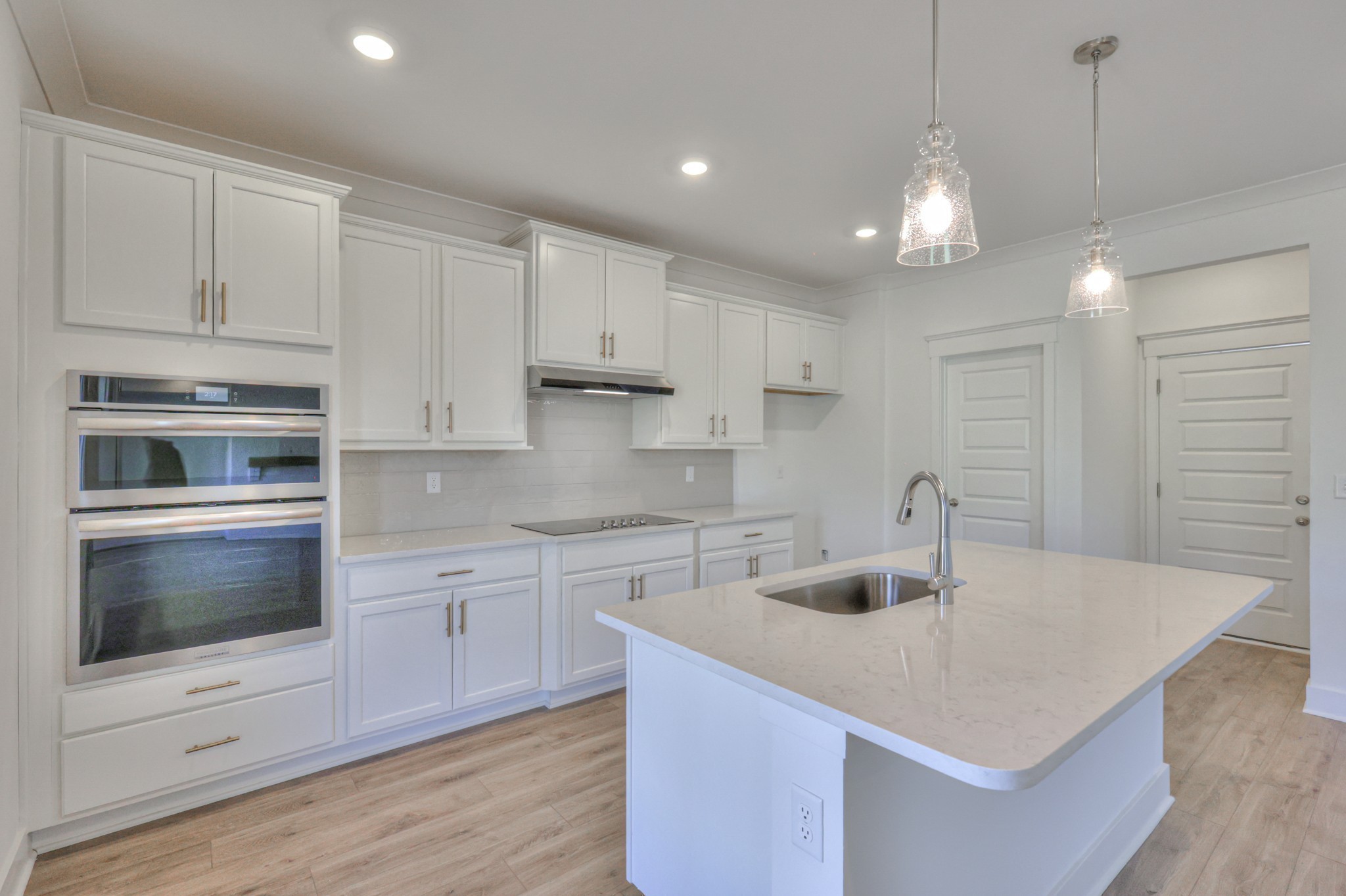 2584 Bluestem Road Columbia, TN 38401 - Photo 15 of 35 a kitchen with kitchen island a sink appliances and cabinets