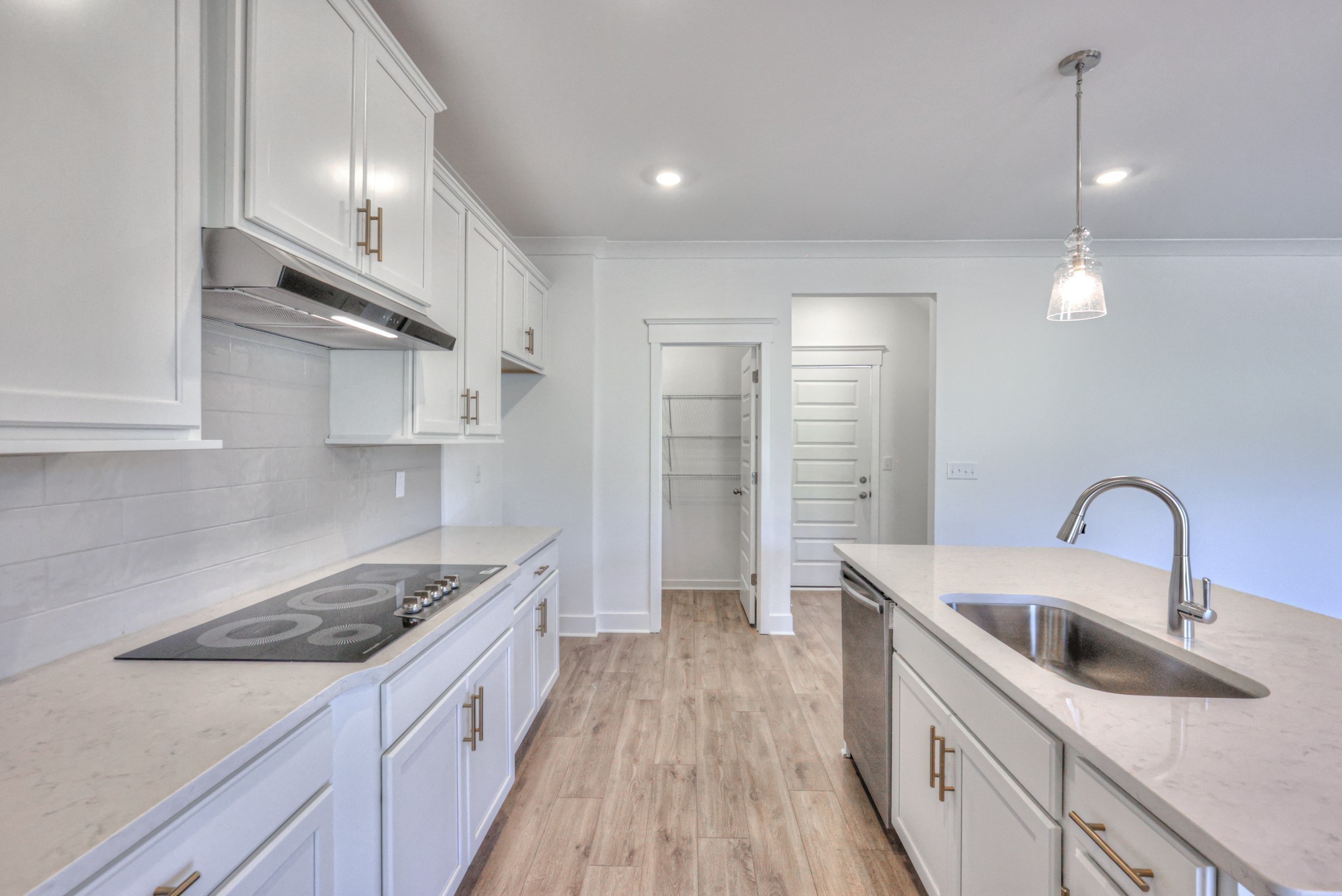 2584 Bluestem Road Columbia, TN 38401 - Photo 20 of 35 a kitchen with stainless steel appliances granite countertop a sink stove and cabinets