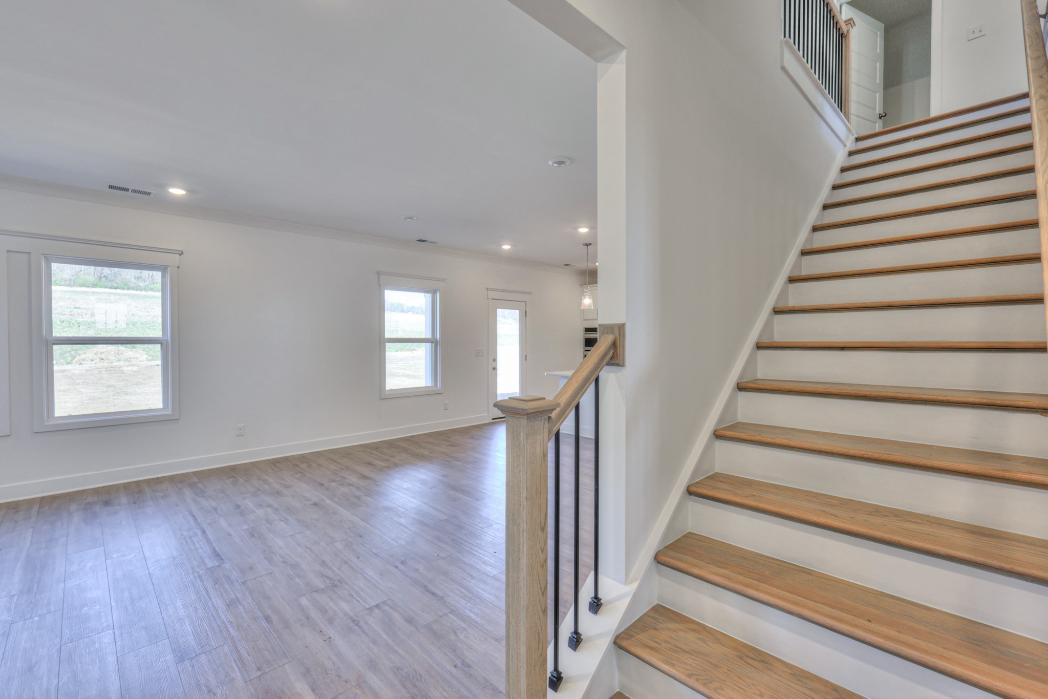 2584 Bluestem Road Columbia, TN 38401 - Photo 21 of 35 a view of a hallway with wooden floor and entryway