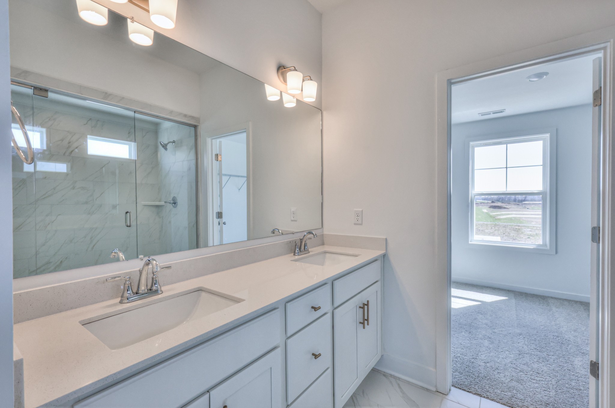 2584 Bluestem Road Columbia, TN 38401 - Photo 29 of 35 a bathroom with a sink double vanity granite tub and a mirror