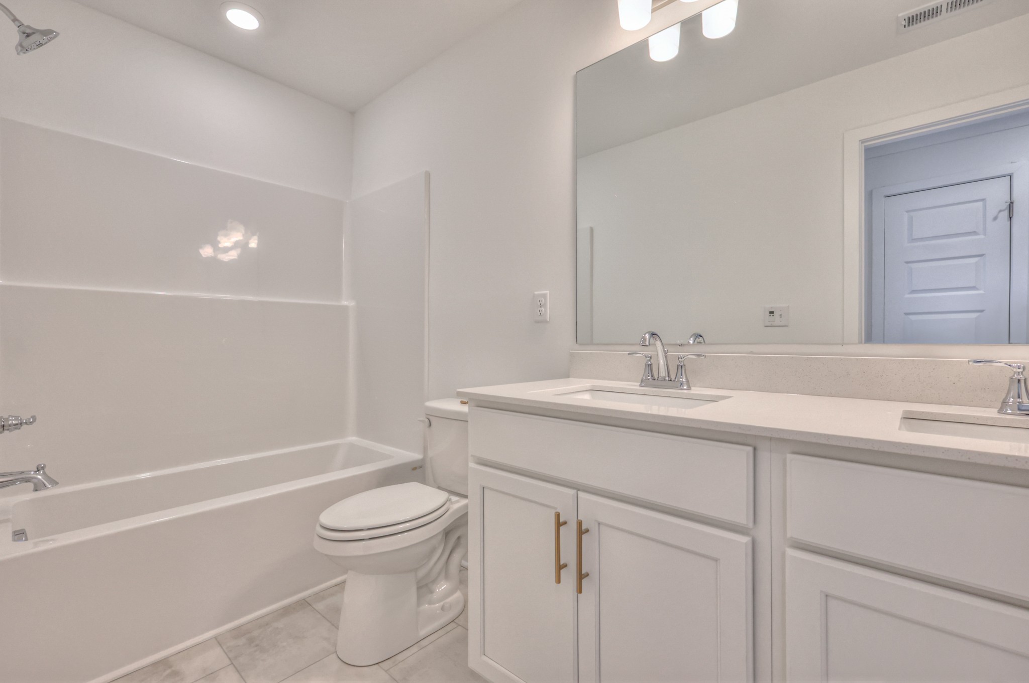 2584 Bluestem Road Columbia, TN 38401 - Photo 5 of 35 a bathroom with a granite countertop sink a toilet and a bathtub