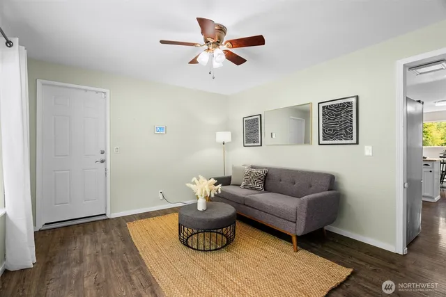 a living room with furniture and a large window