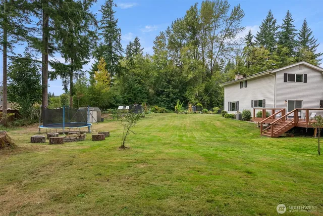 a view of a patio with chairs and a table