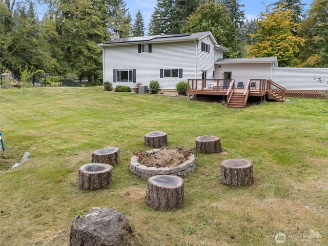 a view of a yard with table and chairs