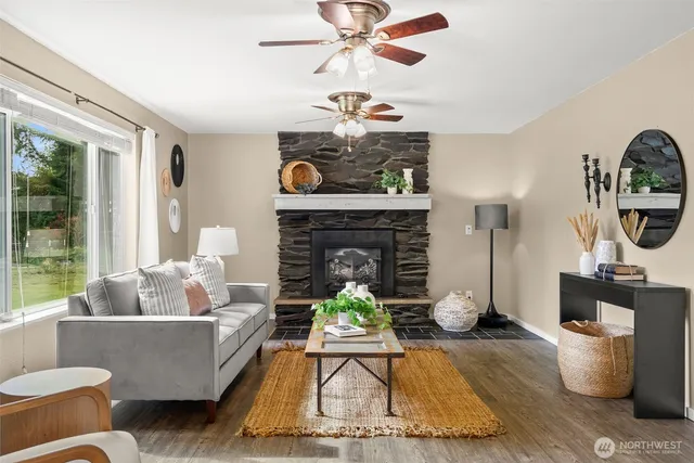 a living room with furniture and a fireplace