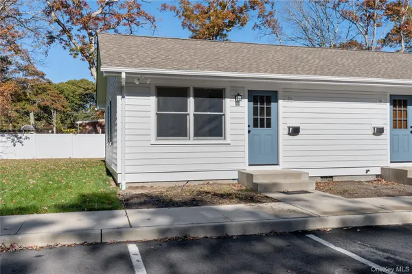 a front view of a house with yard