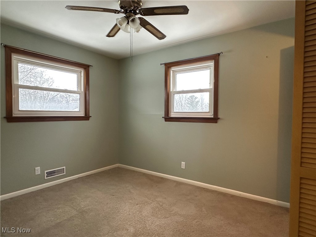 4811 West Pleasant Valley Road Cleveland, OH 44129 - Photo 16 of 31 Carpeted empty room featuring baseboards and ceiling fan