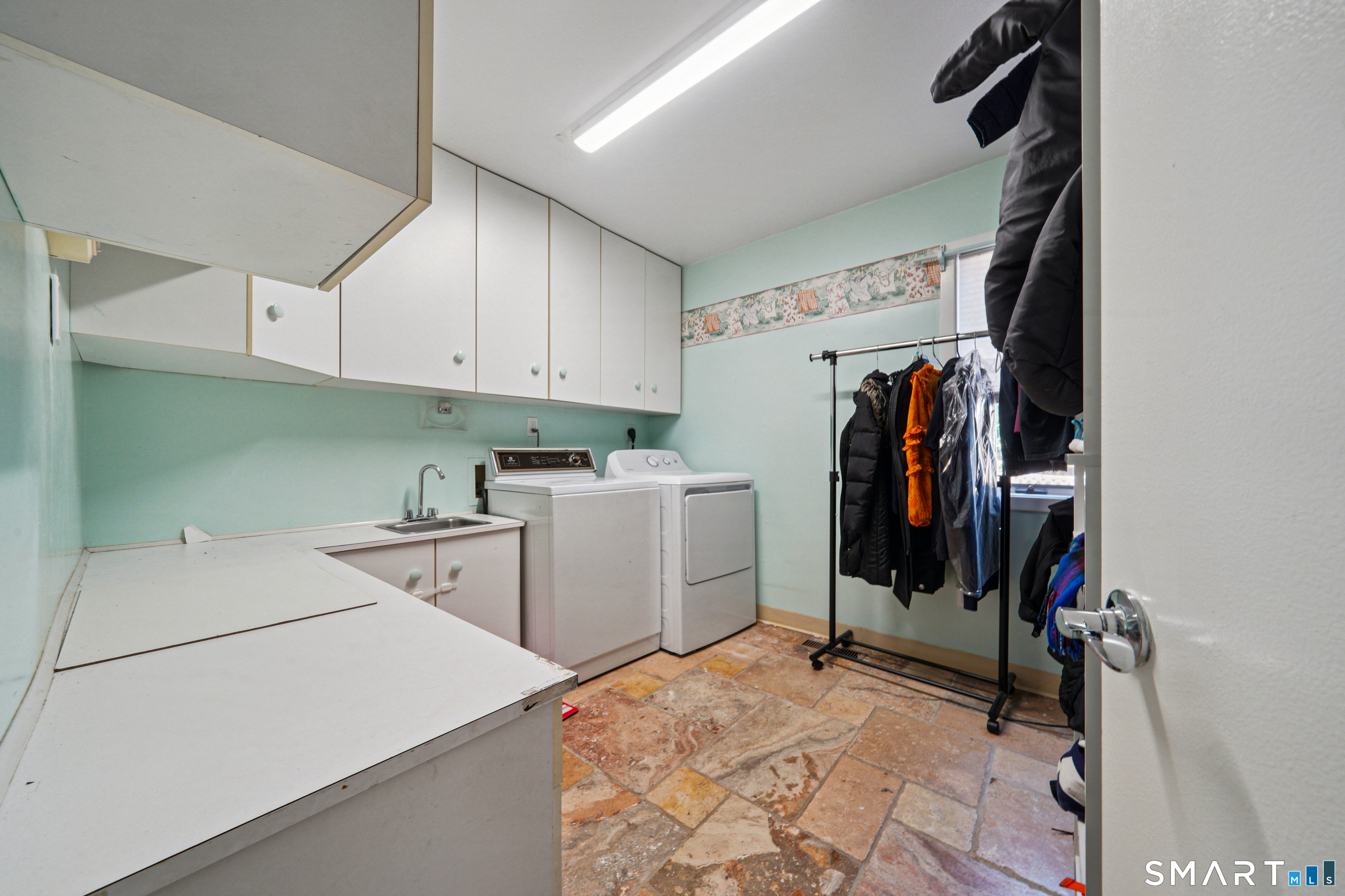 20 Norman Road Stamford, CT 06906 - Photo 12 of 35 a view of storage and utility room with two washing machine