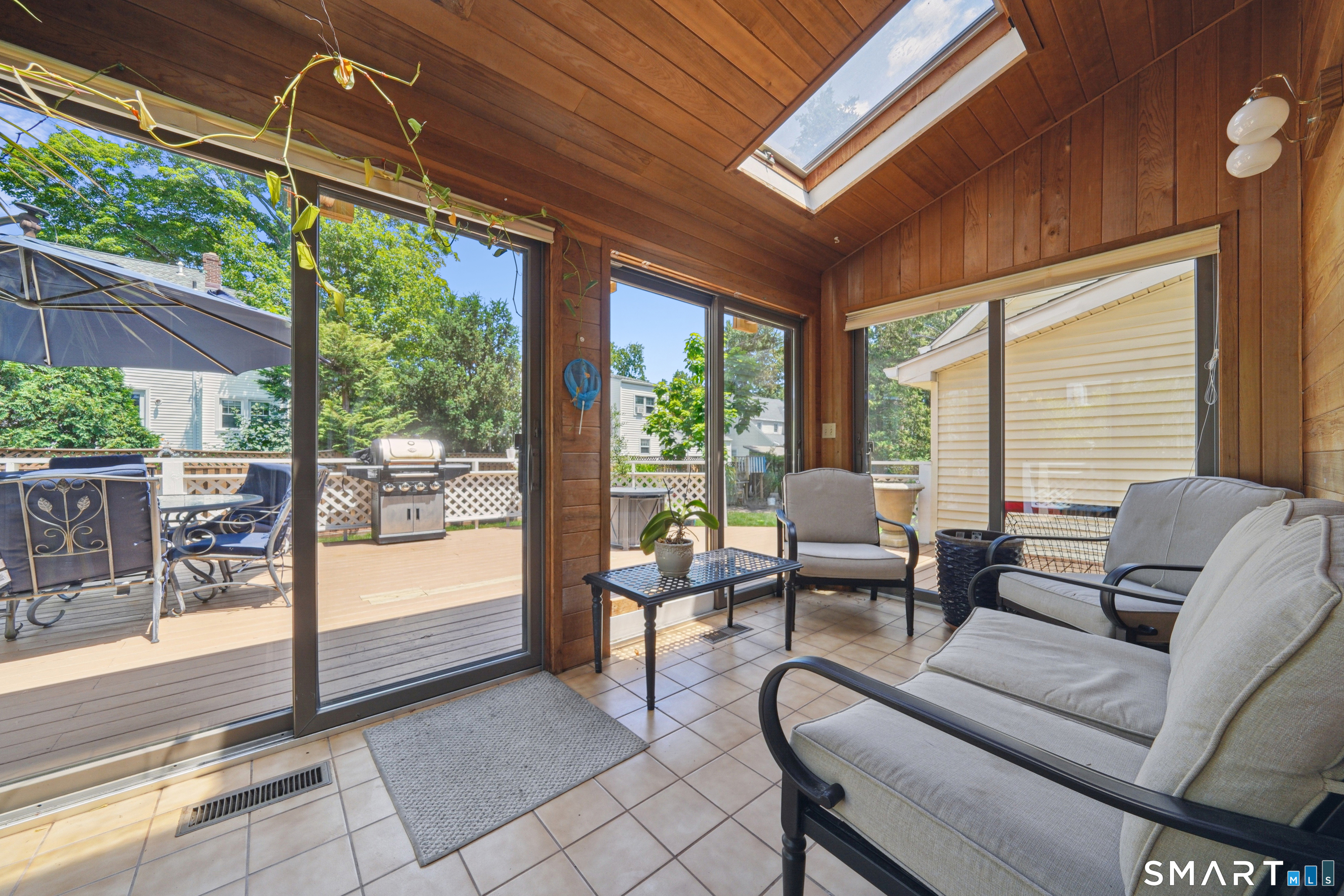 20 Norman Road Stamford, CT 06906 - Photo 13 of 35 a living room with furniture and a floor to ceiling window