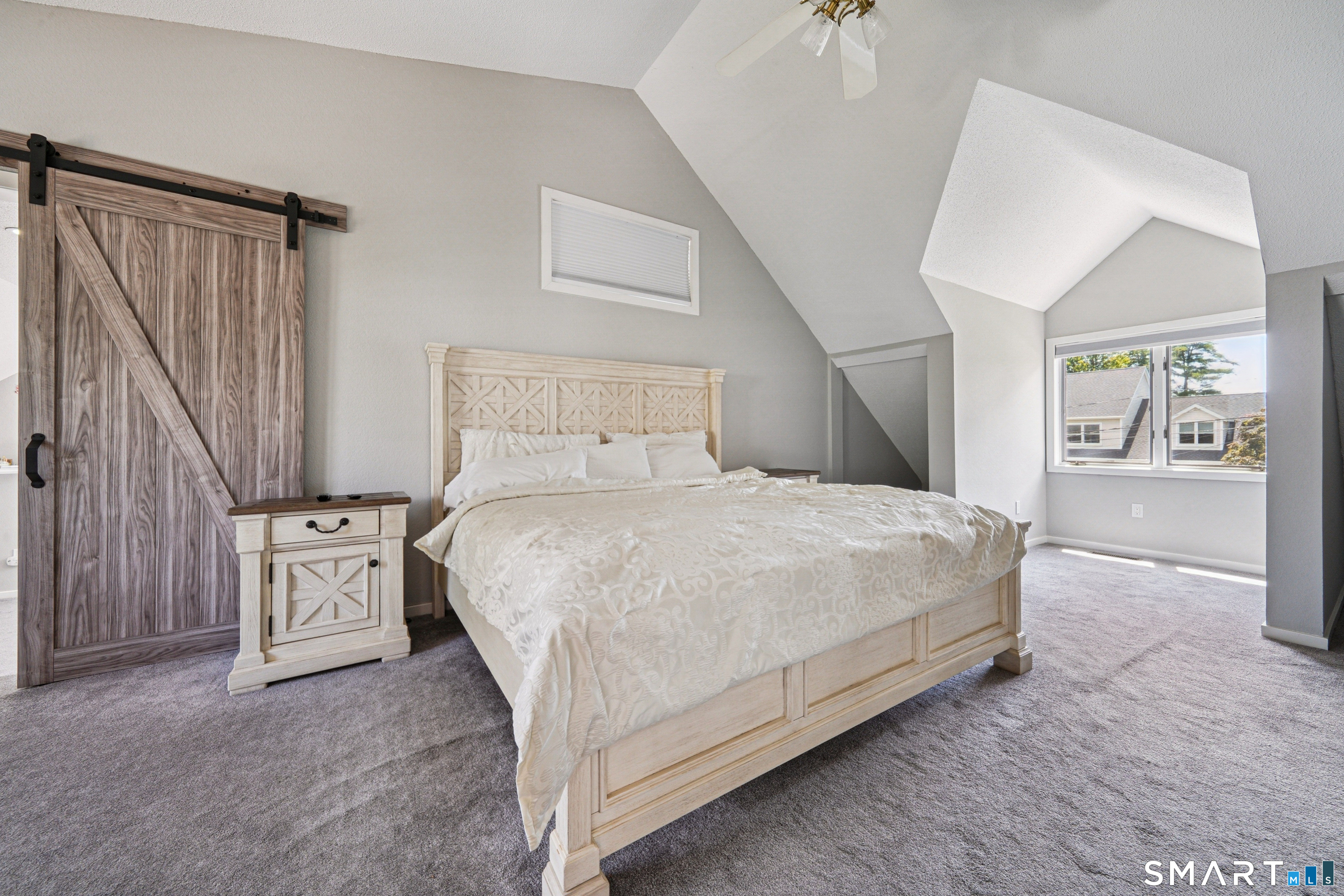 20 Norman Road Stamford, CT 06906 - Photo 16 of 35 a spacious bedroom with a bed and a cabinets