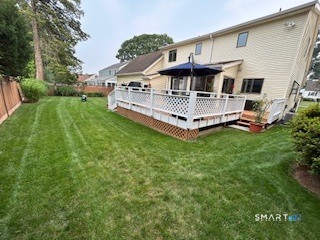 20 Norman Road Stamford, CT 06906 - Photo 28 of 35 a view of a house with a big yard and deck