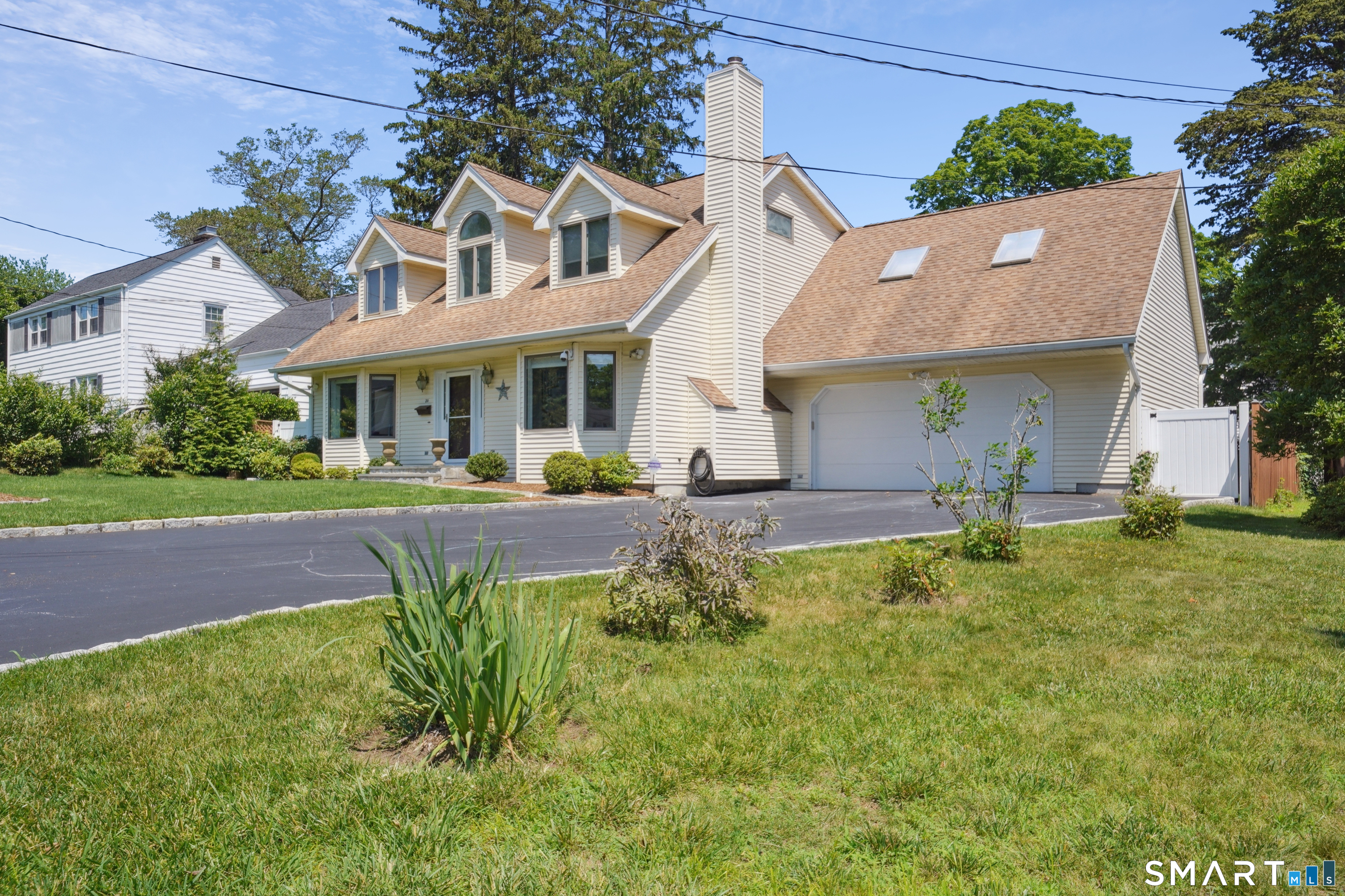 20 Norman Road Stamford, CT 06906 - Photo 29 of 35 a front view of a house with garden