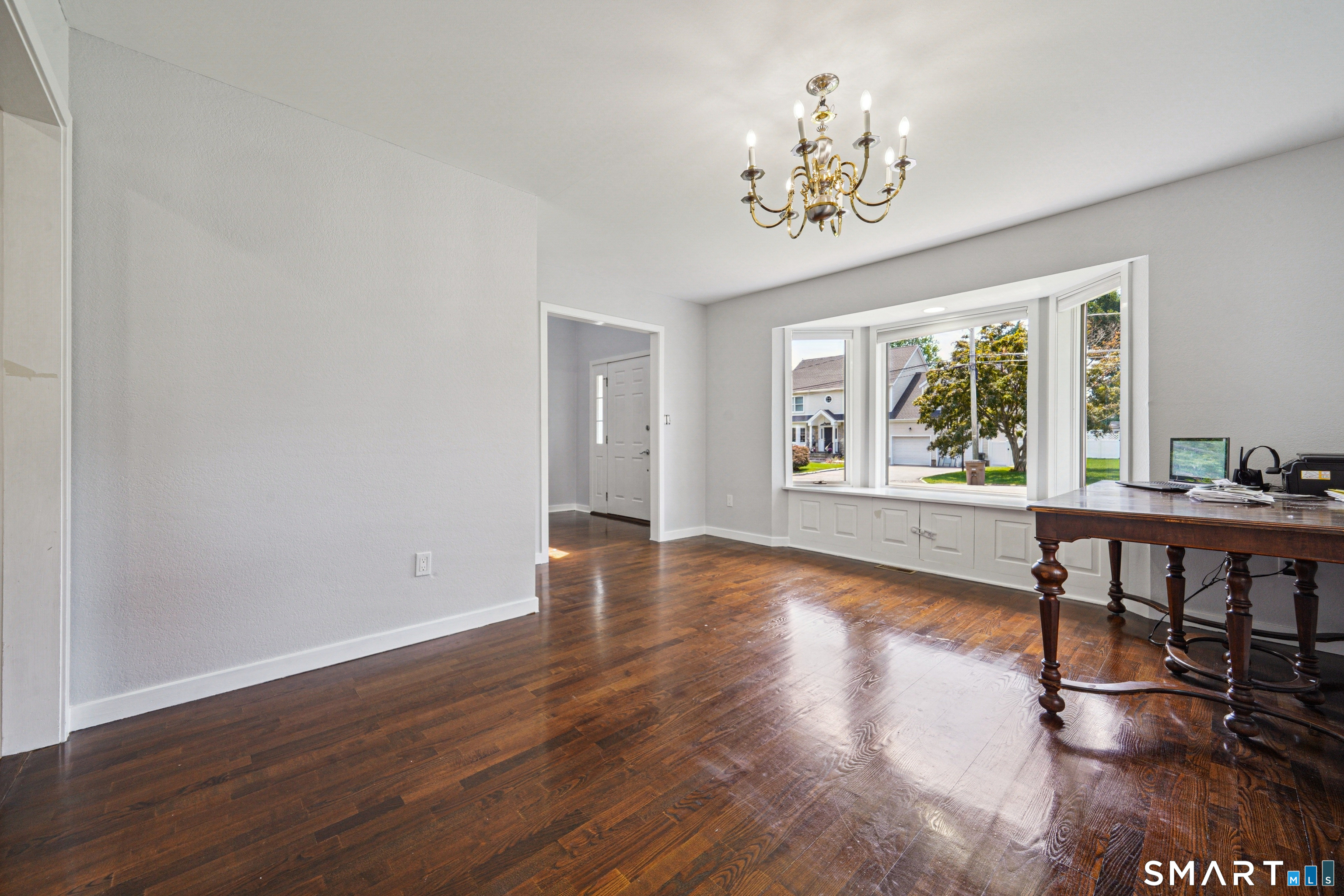 20 Norman Road Stamford, CT 06906 - Photo 7 of 35 a view of an empty room with window and wooden floor