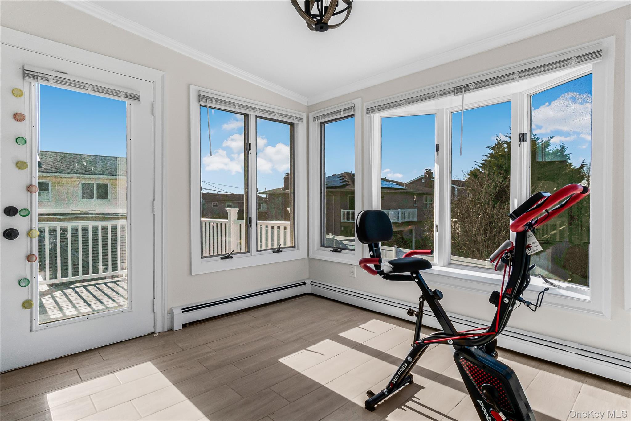 107 Beverly Road Massapequa, NY 11758 - Photo 15 of 30 a living room with furniture and a window