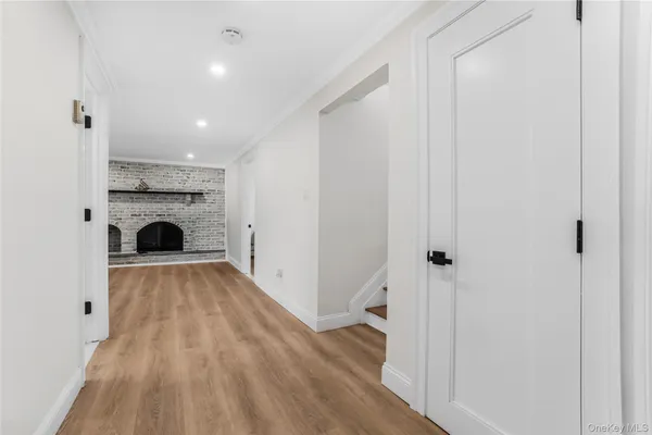 a view of livingroom with fireplace wooden floor and window