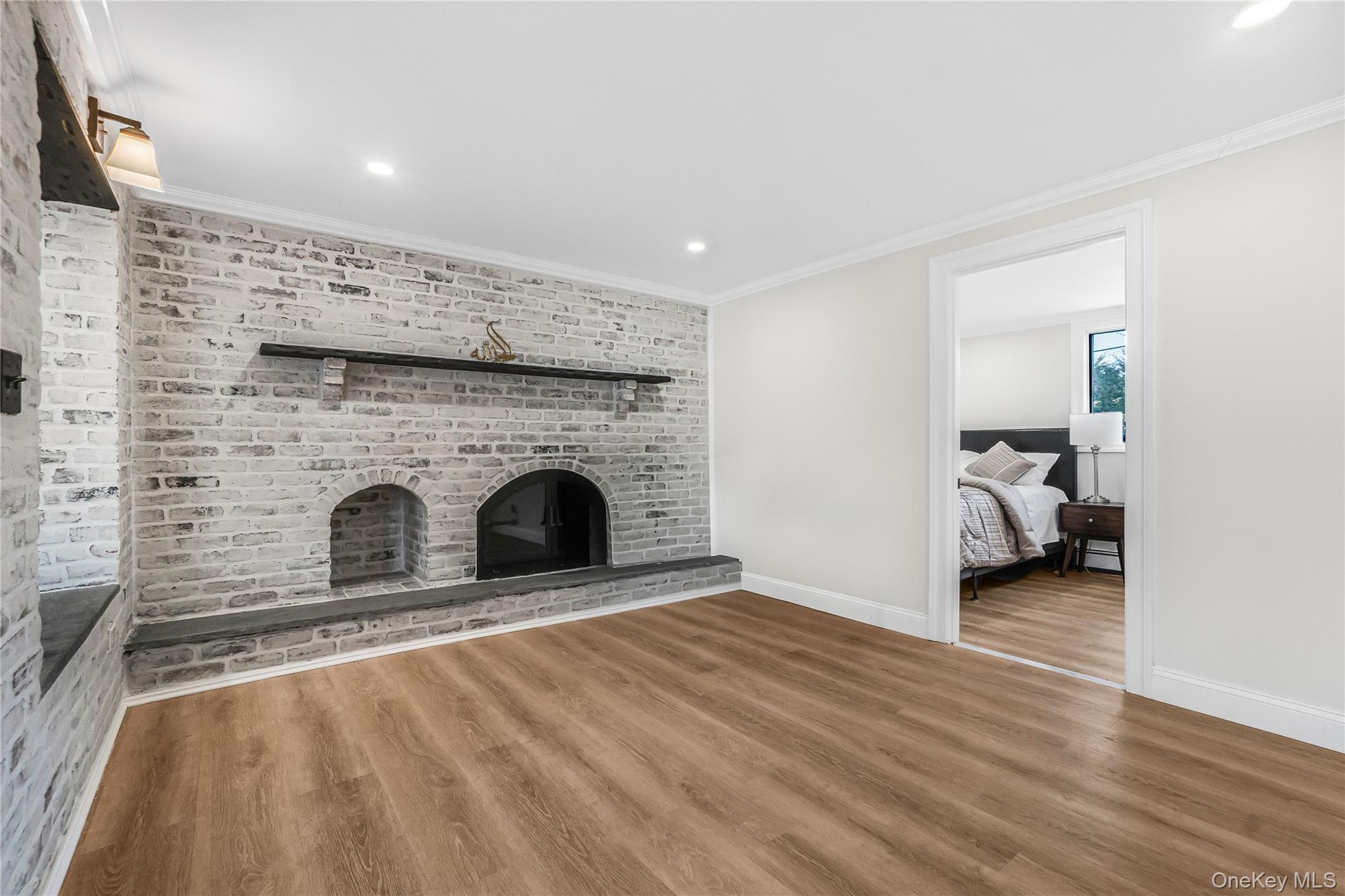 107 Beverly Road Massapequa, NY 11758 - Photo 4 of 30 a living room with furniture and a fireplace