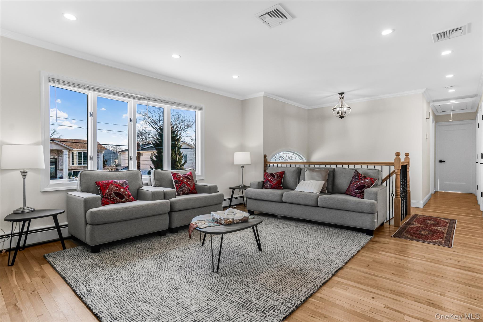 107 Beverly Road Massapequa, NY 11758 - Photo 7 of 30 a living room with furniture and a large window