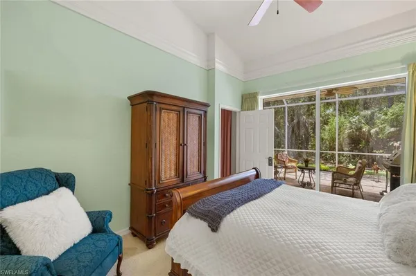 a bedroom with a bed and dresser