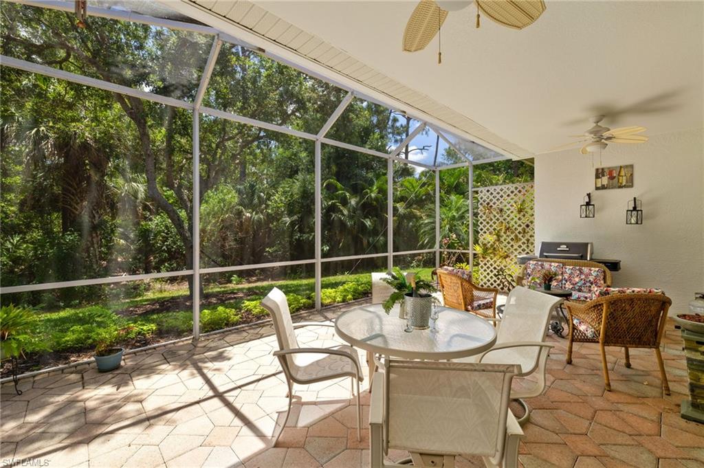 1409 Athol Way, Unit 101 Naples, FL 34104 - Photo 16 of 37 Sunroom featuring a ceiling fan and outdoor dining space