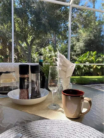 a view of an chairs and table in the patio