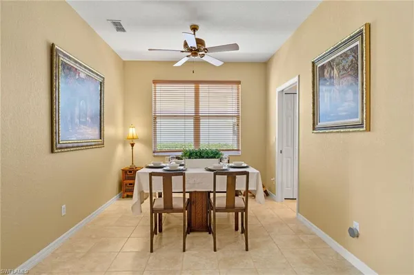 a view of a dining room with furniture window and outside view