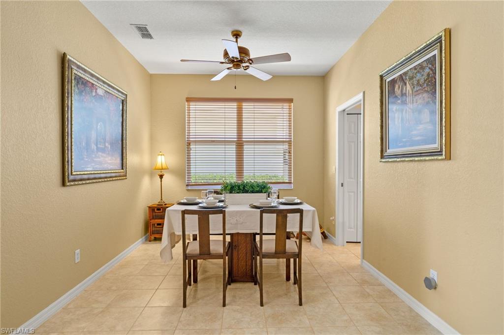 1409 Athol Way, Unit 101 Naples, FL 34104 - Photo 6 of 37 Dining space featuring light tile patterned floors, baseboards, a ceiling fan, and visible vents