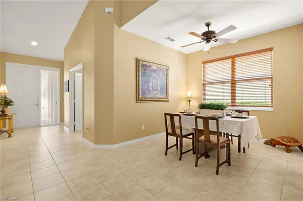 a view of a dining room with furniture and window