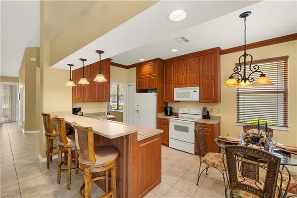 a kitchen with a sink cabinets and window