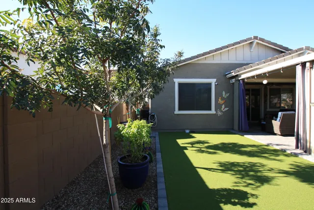 a living room with patio furniture