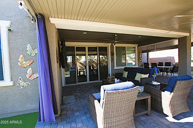 a living room with lots of furniture and kitchen view