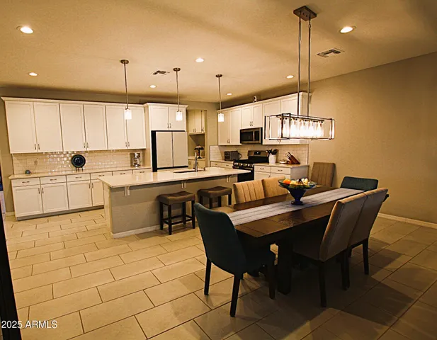 a kitchen with appliances cabinets and a sink