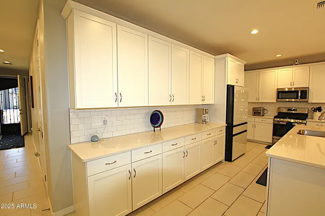 a bathroom with a shower and a glass door