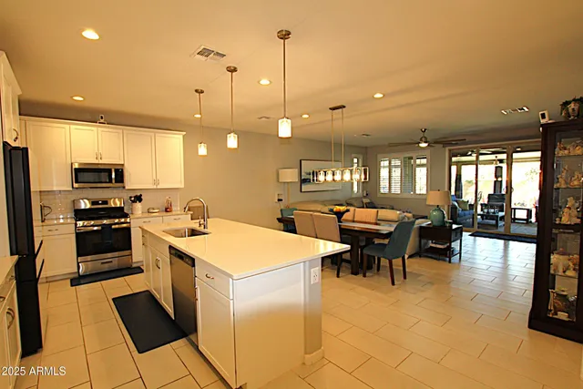 a view of a hallway with furniture and a livingroom view