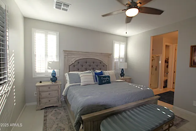 a view of a livingroom with furniture and floor to ceiling window