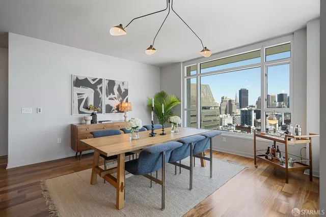 a view of a dining room with furniture window and outside view