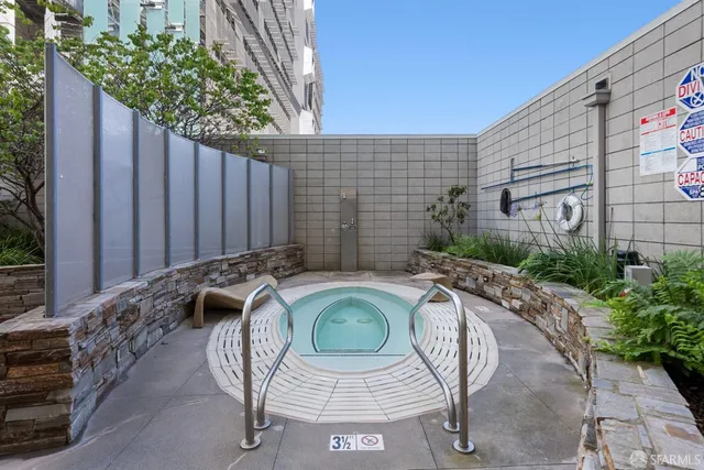 a view of balcony with couch and chairs
