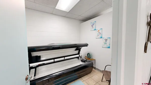 a room with wooden floor and furniture