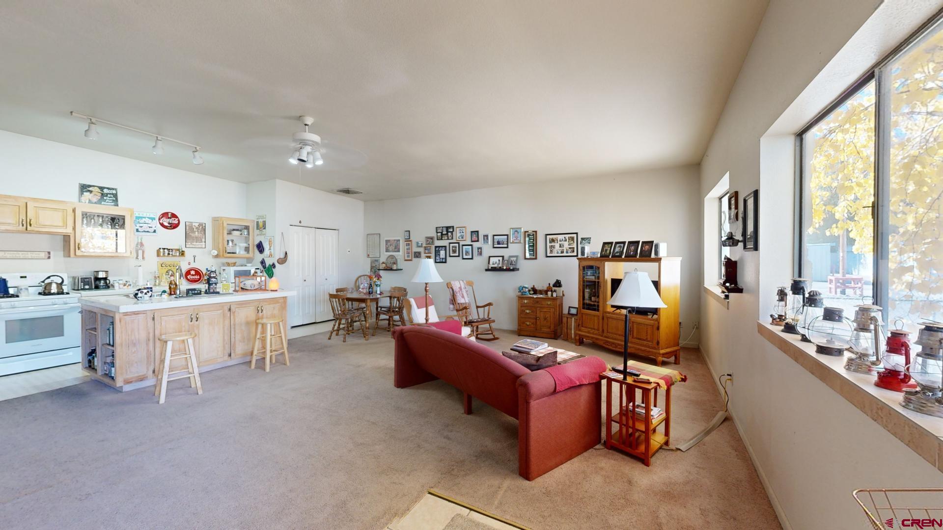 1449 Florida Road Durango, CO 81301 - Photo 18 of 35 a living room with furniture and a large window