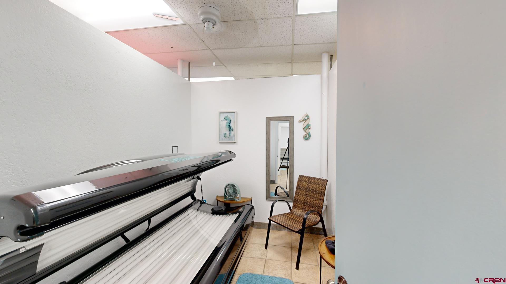 1449 Florida Road Durango, CO 81301 - Photo 25 of 35 a room with wooden floor and furniture