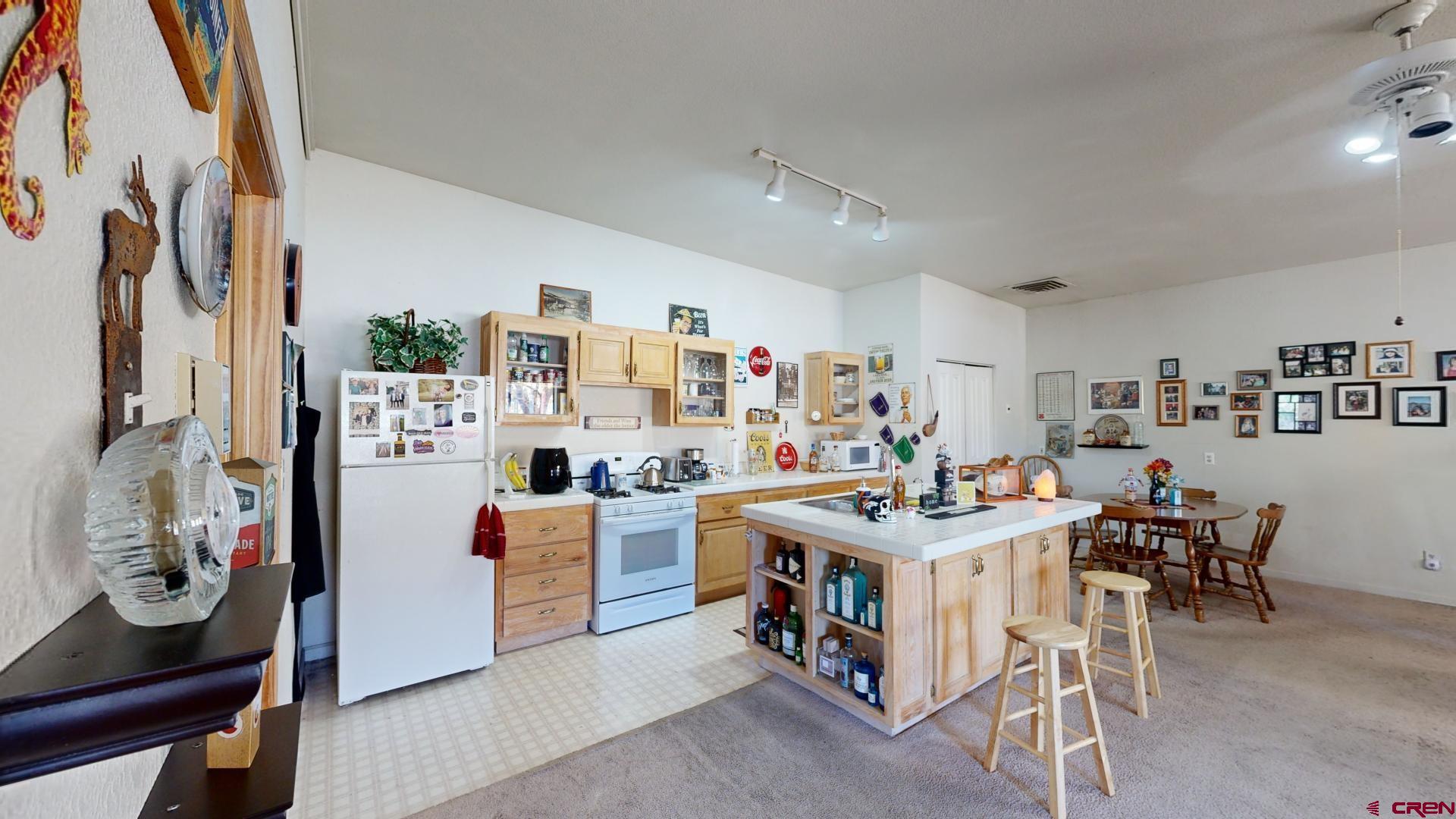 1449 Florida Road Durango, CO 81301 - Photo 29 of 35 a view of a dining room with furniture and a kitchen