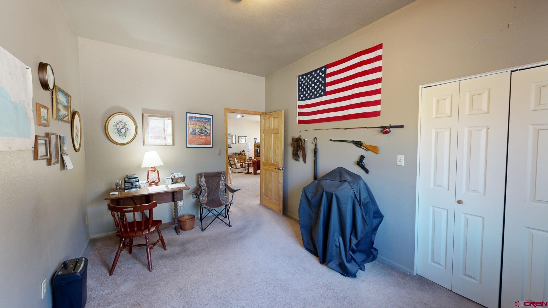 1449 Florida Road Durango, CO 81301 - Photo 32 of 35 a room that has a rug and a chair