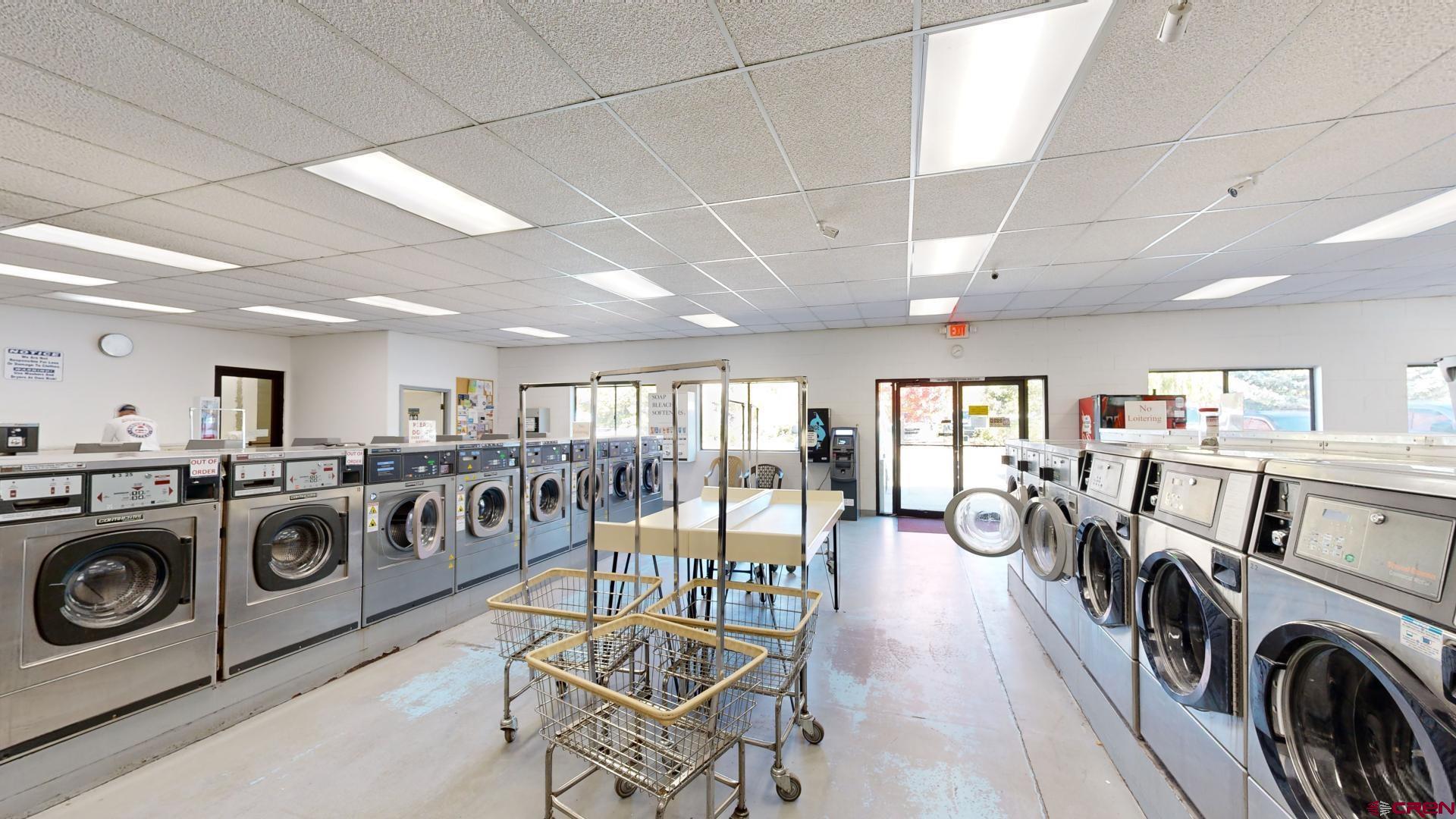 1449 Florida Road Durango, CO 81301 - Photo 7 of 35 a view of a dining room with furniture a rug and windows