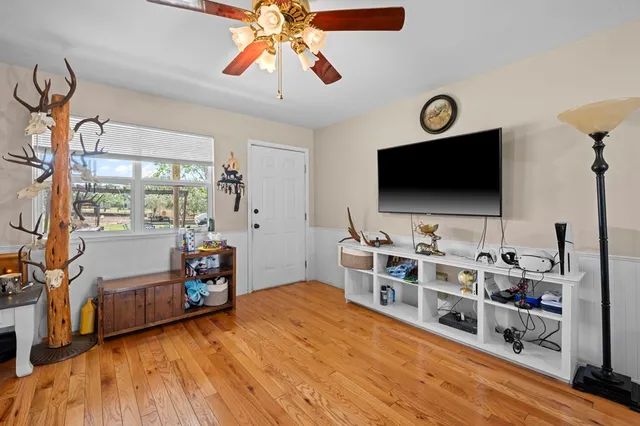 a room with furniture and a flat screen tv