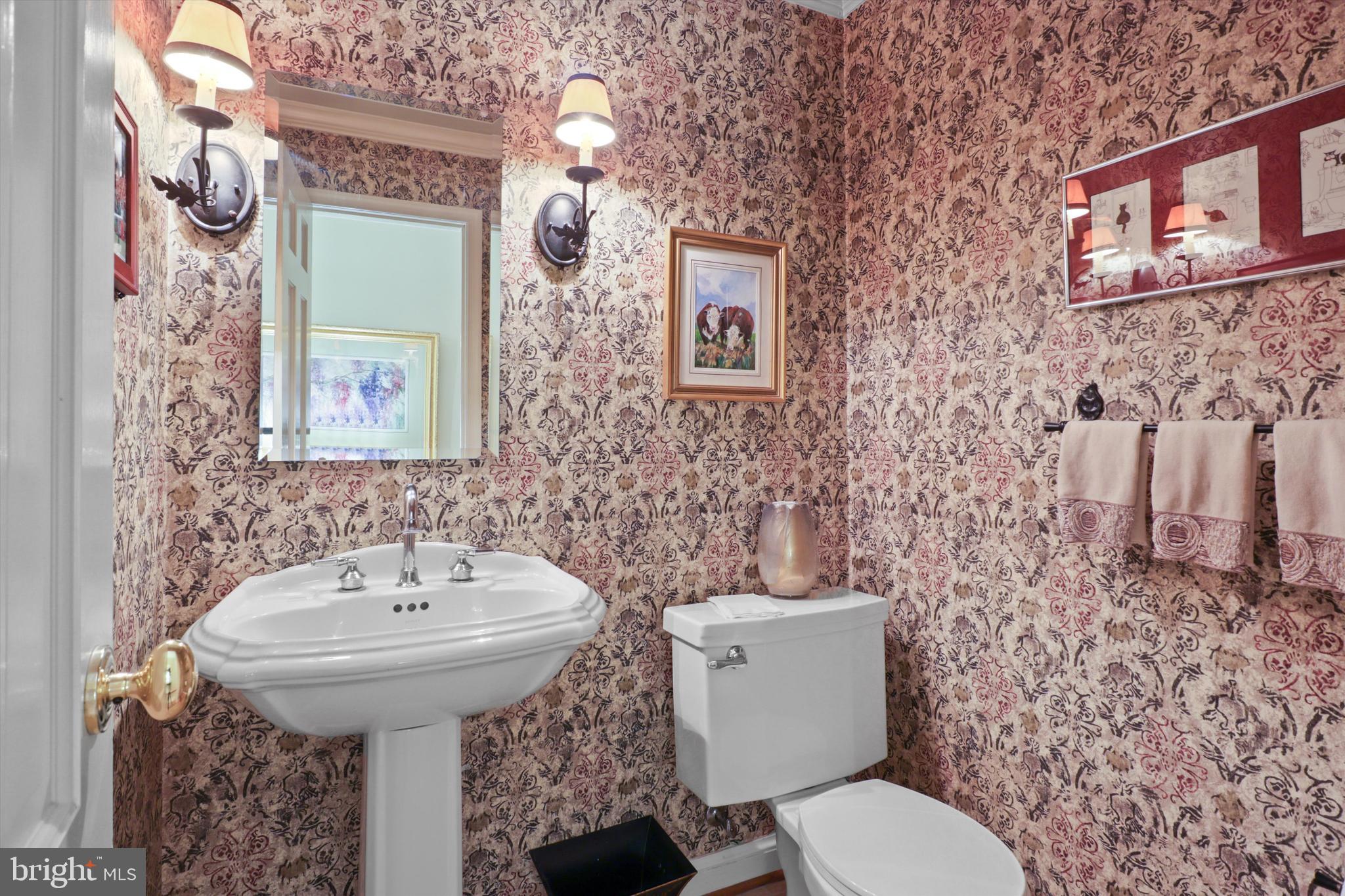 2905 Dartmouth Road Alexandria, VA 22314 - Photo 16 of 28 a bathroom with a toilet sink and mirror