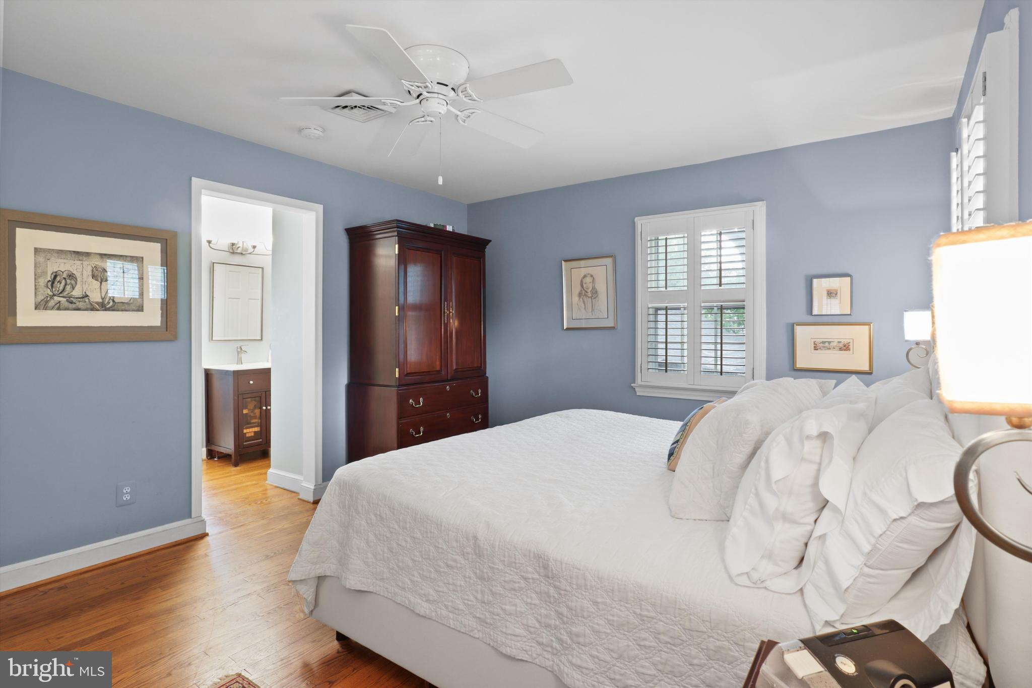2905 Dartmouth Road Alexandria, VA 22314 - Photo 17 of 28 a bedroom with a bed and wooden floor
