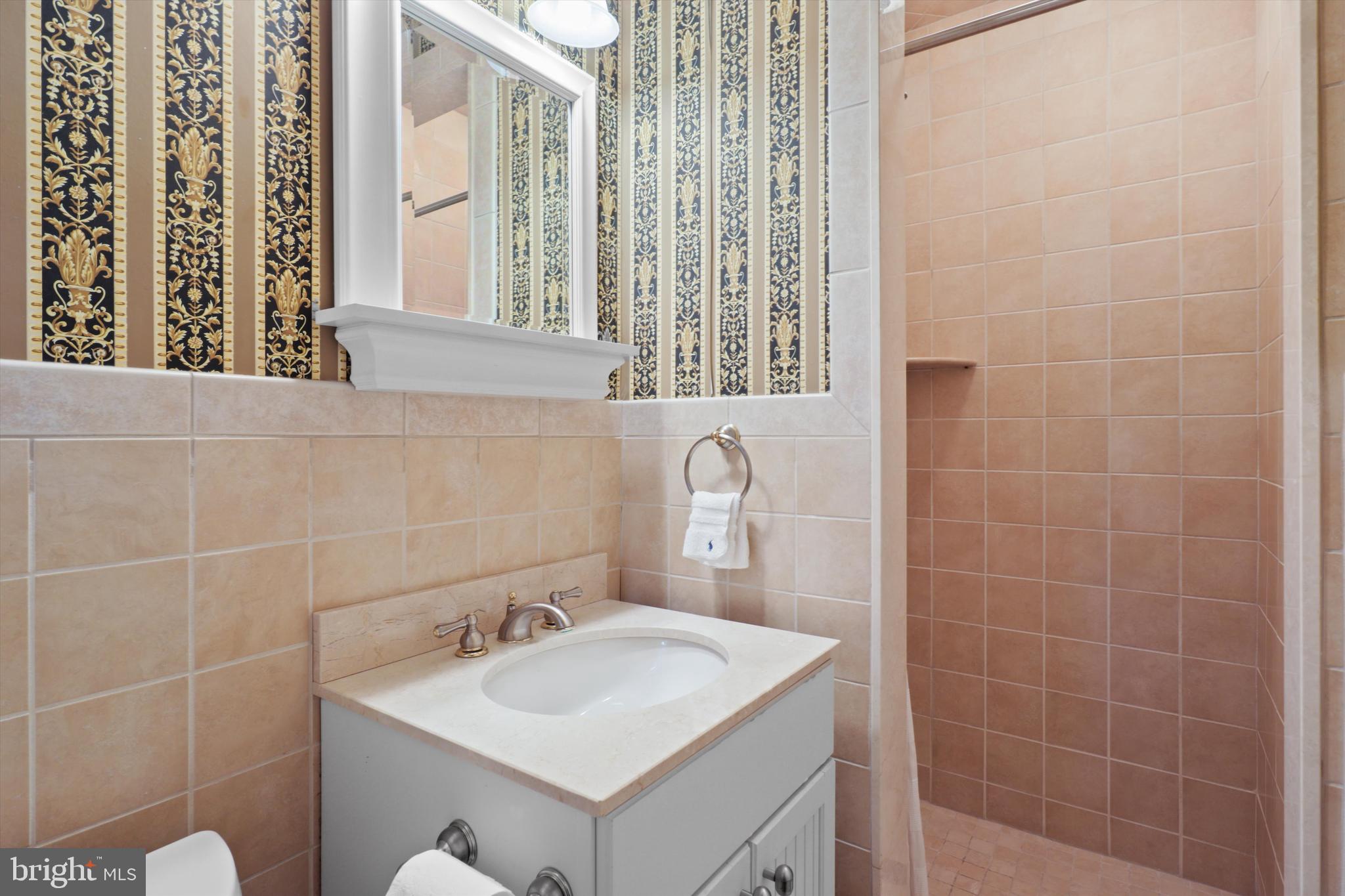 2905 Dartmouth Road Alexandria, VA 22314 - Photo 23 of 28 a bathroom with a sink a toilet and a mirror