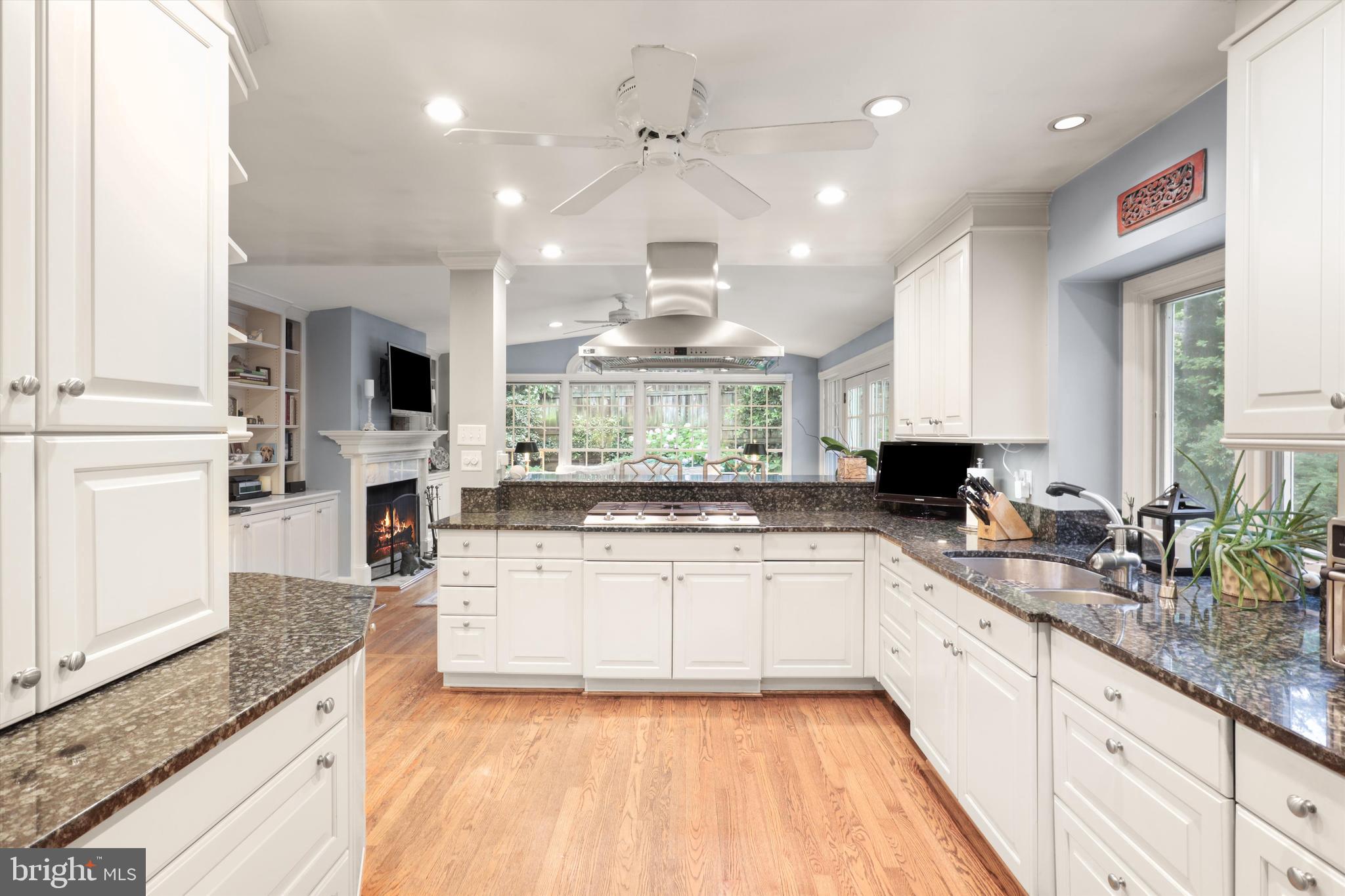 2905 Dartmouth Road Alexandria, VA 22314 - Photo 5 of 28 a large kitchen with stainless steel appliances kitchen island granite countertop a sink and white cabinets