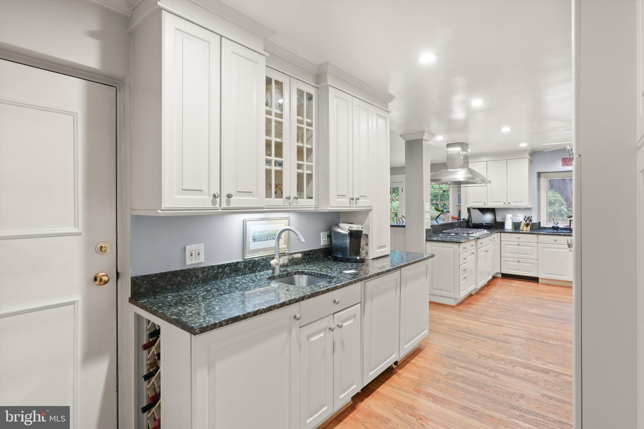 2905 Dartmouth Road Alexandria, VA 22314 - Photo 6 of 28 a kitchen with stainless steel appliances granite countertop a sink stove and cabinets