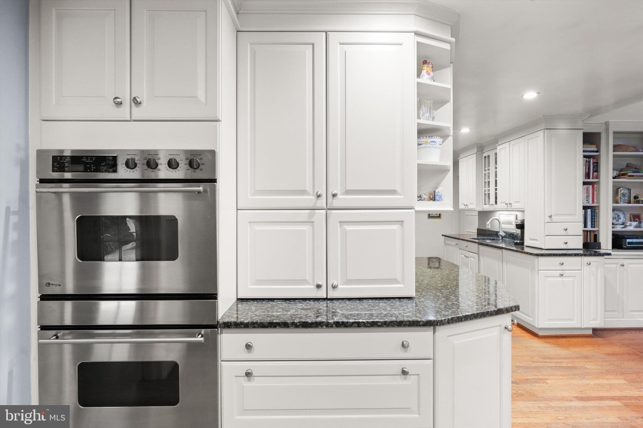 2905 Dartmouth Road Alexandria, VA 22314 - Photo 8 of 28 a kitchen with granite countertop white cabinets and stainless steel appliances