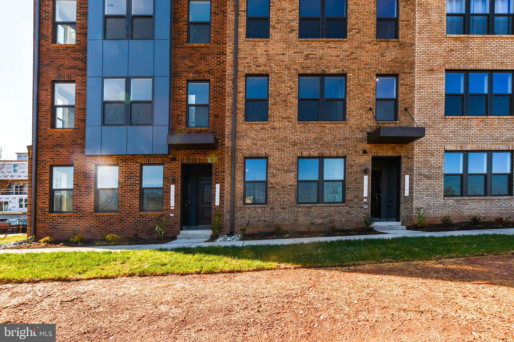 44502 Wolfhound Square Ashburn, VA 20147 - Photo 1 of 100 a front view of a brick house with a yard